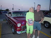 The Dregers are smiling about their 55 Chevy's State Farm Outstanding Cruiser plaque.