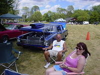 Terry & Carol Bistue take a break from viewing the cruisers.