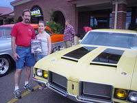 Chuck beams with his sweet daughter, RH BoS award & his awesome 72 Olds 442