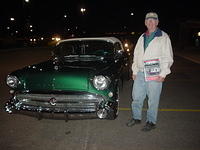 Carl Anderson smiles with his Rick Murray State Farm Outstanding Cruiser award & gorgeous 57 Buick convt.