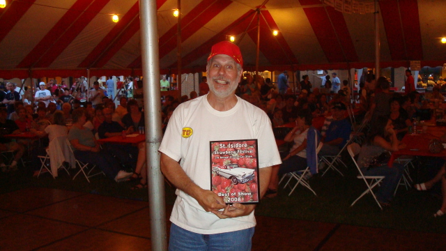 Bert Bernardi wins his award for his perfect 1936 Ford convertible.